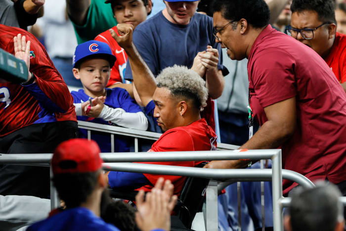 Edwin Diaz is carted off in a wheelchair after suffering an apparent knee injury playing for Puerto Rico in the WBC